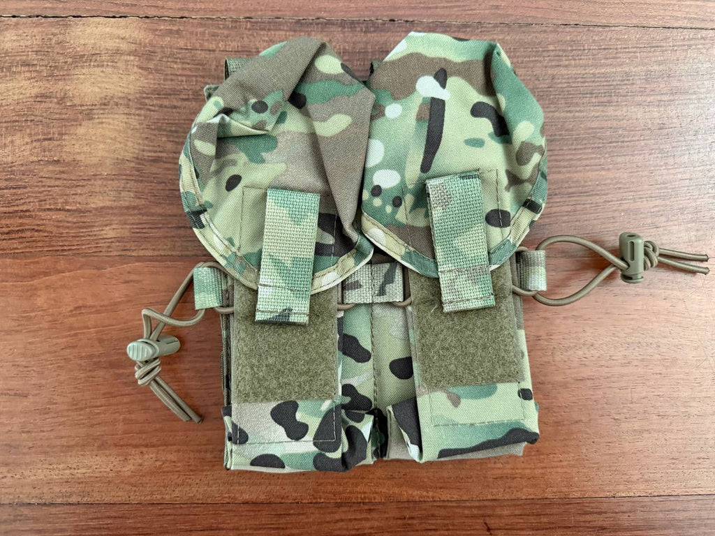 Russian Ana Tactical 4-Cell AK Mag Pouch - Multicam tactical pouch made from durable material with secure closure and adjustable cords, designed for carrying AK magazines in a multicam pattern.