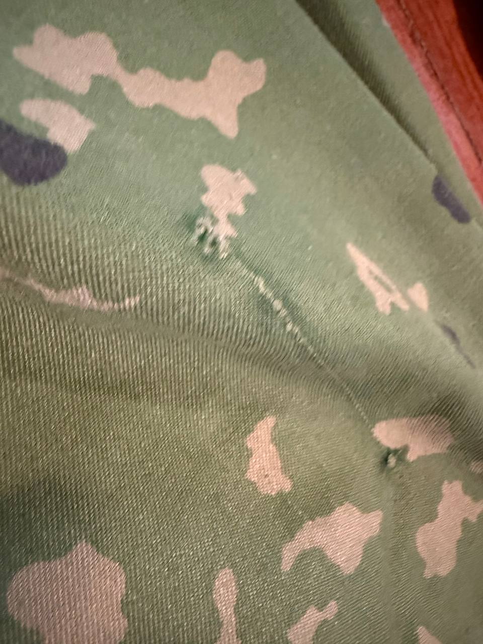 Close-up detail of fabric pattern showing green and beige camouflage with small holes on material from (USED) Russian SSO Partizan Sever Suit - Size 56-58/5.