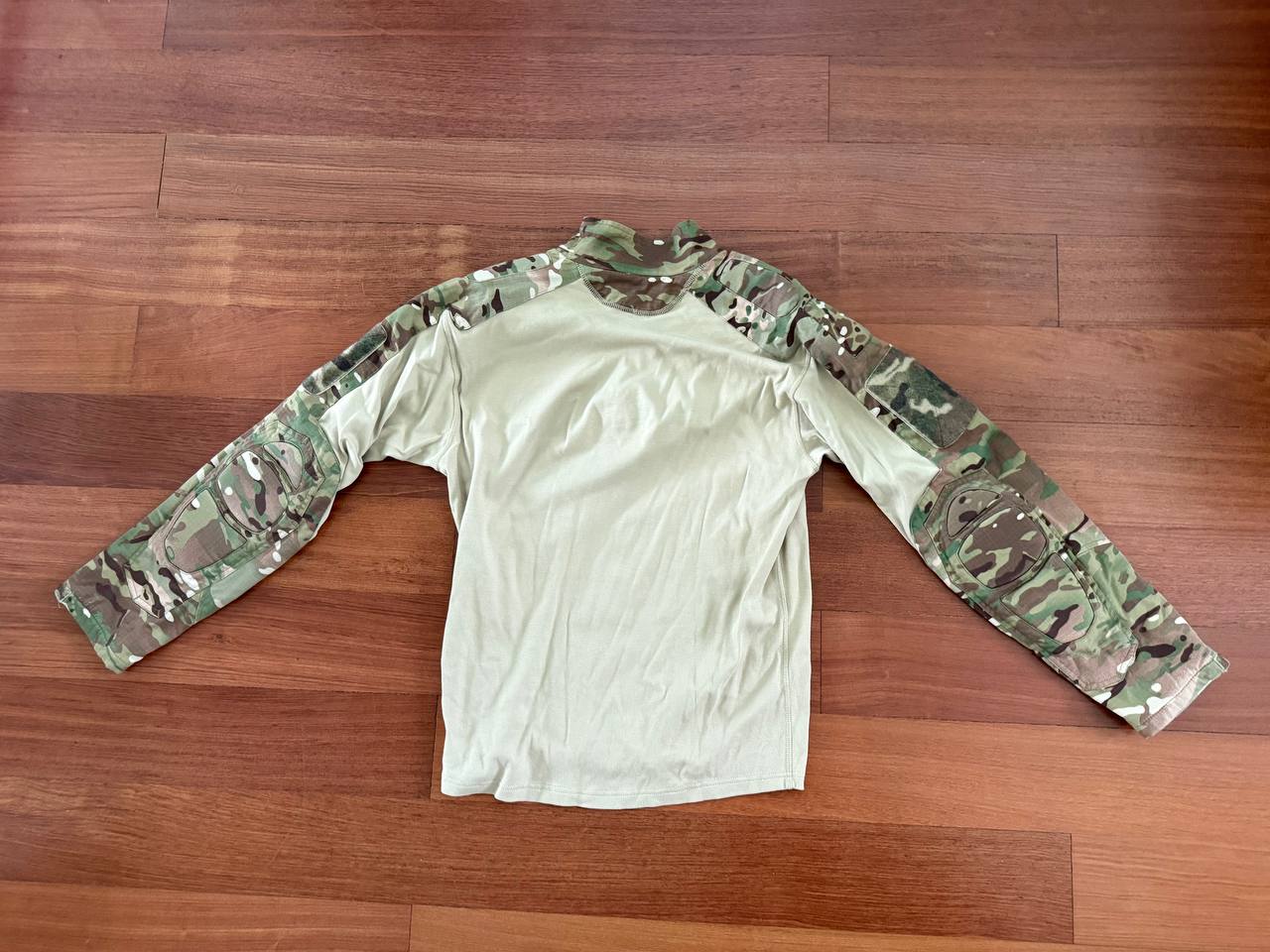 Russian Slavyanka FSB Contract Set – Multicam - Size 54/5 long-sleeve tactical shirt with camouflage sleeves and solid tan body laid flat on wooden floor, showcasing Russian surplus gear.