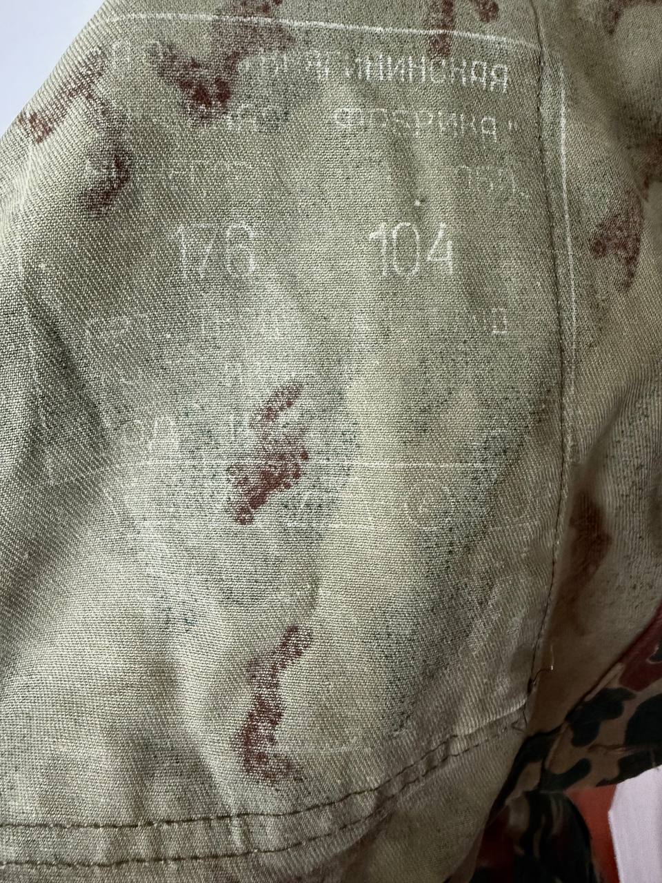 Close-up of fabric texture and faded Russian markings on a Russian VSR-93 Summer Jacket – Size 52/4, showing worn details of this Russian surplus military garment.