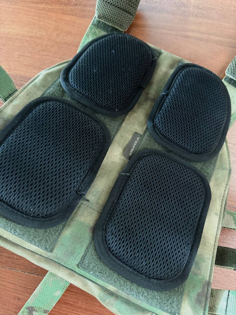 Close-up of the inner side of the Russian Wartech TV-110 Vest - A-TACS FG Camo - Pre-War Production showing black padded panels on camouflage fabric surface.