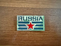 The Russian Soviet Red Star Design Patch - MultiCam Badge by Tanki Store features RUSSIA in bold, a central red star, and green/gray stripes—ideal for bulk orders or to complete your patch collection.