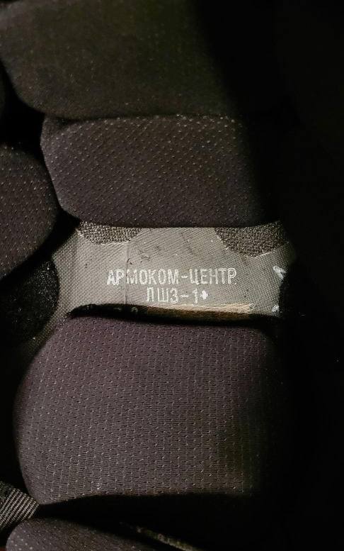 Close-up view of the interior padding and label inside the Russian LShZ 1+ Highcut Opscore Helmet - Size 3 + Multicam Cover, showing fabric texture and manufacturer details.