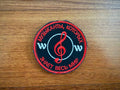 The PMC Wagner Badge by Tanki Store is a round Russian Army military patch featuring a red treble clef, Russian text, and musical symbols on black with red border—ideal for bulk orders or collectors.
